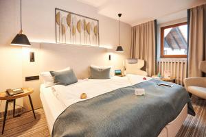 Postel nebo postele na pokoji v ubytování Flair Hotel Werbetal