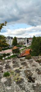a view of a park with trees and a fountain at Le Godefroy de Bouillon in Boulogne-sur-Mer +22 photos