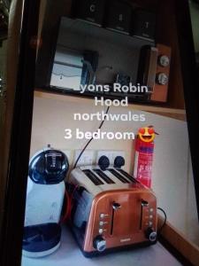 a refrigerator with a toaster and a toaster and a blender at Deluxe 3 bedroom Lyons Robin hood oaklands with free wifi free sky in Meliden