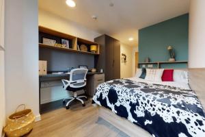 a bedroom with a bed and a desk and a chair at Private Bedrooms with Shared Kitchen, Studios and Apartments at Canvas Wembley in London in London