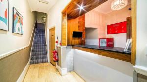 a hallway with a staircase and a fire hydrant at The Park Hotel in London