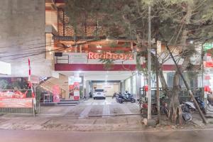 a parking garage with a car parked in it at RedDoorz Syariah at Cigadung Raya Street in Bandung