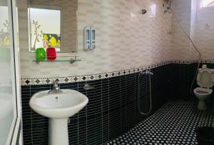 a bathroom with a sink and a toilet at Phương Thảo Hotel in Hanoi