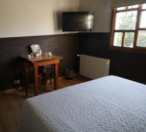 Cama ou camas em um quarto em Las Avutardas Hosteria