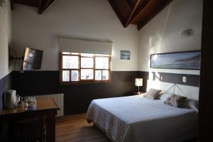 Cama ou camas em um quarto em Las Avutardas Hosteria