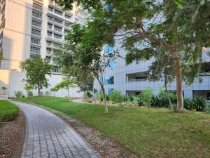a walkway in front of a building at Furnished apartment with Burj Khalifa View in Dubai