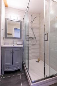 a bathroom with a shower and a sink at Résidence Le Necou - Les Ménuires in Les Menuires