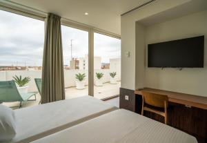 Postel nebo postele na pokoji v ubytování Teide Rooms + 37 fotografií