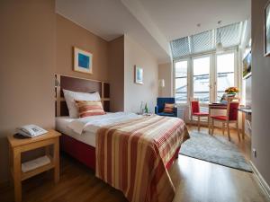 Postel nebo postele na pokoji v ubytování EA Hotel Julis