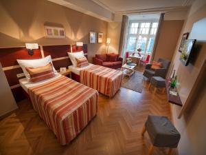 Postel nebo postele na pokoji v ubytování EA Hotel Julis