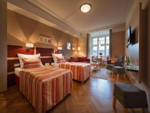 Postel nebo postele na pokoji v ubytování EA Hotel Julis