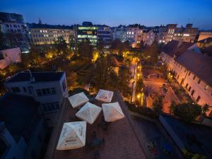 an overhead view of a city at night at EA Hotel Julis in Prague