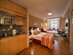Postel nebo postele na pokoji v ubytování EA Hotel Julis