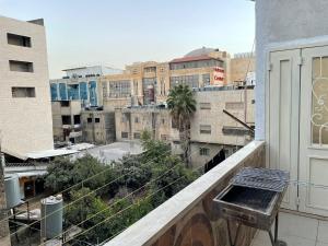a view of a city from a balcony at Alsharif family in Hebron