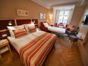Postel nebo postele na pokoji v ubytování EA Hotel Julis