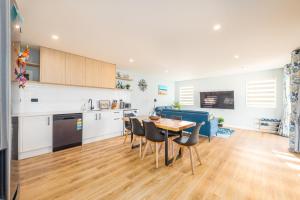 a kitchen and dining room with a table and chairs at 37 Galaxy B in Lake Tekapo