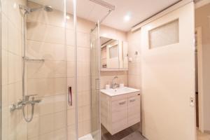 a bathroom with a shower and a sink at Diamond Suite in Kanoni