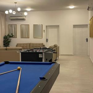 a billiard room with a pool table in it at Dhakira Resort in Adh Dhakhīrah