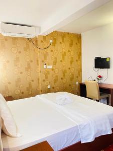 Postel nebo postele na pokoji v ubytování Sundale Hotel