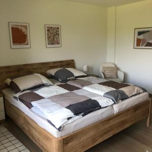 a large wooden bed in a room with at Ferienwohnung am Eggegebirge in Bad Driburg