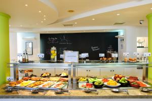 a buffet line with many different types of food at Golden Star City Resort in Perea