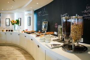 a kitchen with a counter with food on it at Golden Star City Resort in Perea