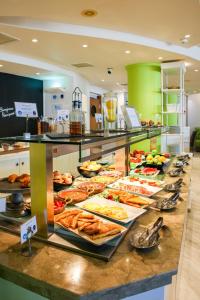 a buffet line with many different types of food at Golden Star City Resort in Perea