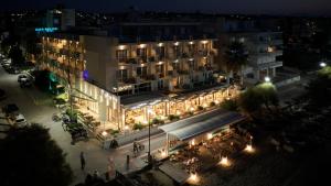 an overhead view of a hotel at night with lights at Golden Star City Resort in Perea