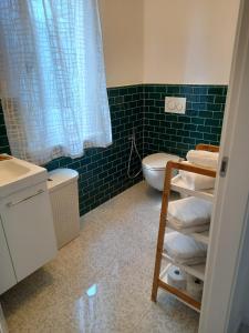 a bathroom with a toilet and a sink at Mercante In Fiera in Verona