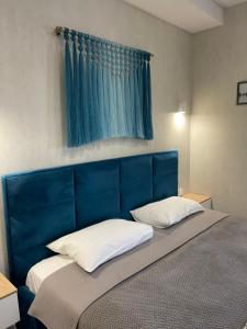 Кровать или кровати в номере Home Aparts