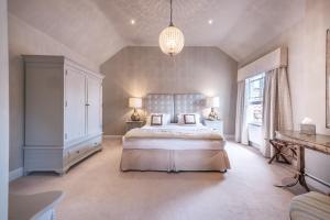 a bedroom with a bed with two pillows on it at The Packhorse Inn in Newmarket