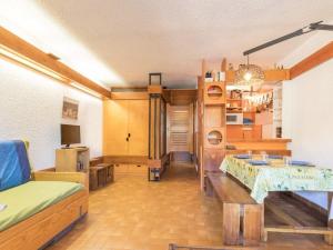 a living room with a couch and a table at Studio pour 4 pers à Chantemerle, Serre-Chevalier avec balcon, parking et équipements complets - FR-1-330E-70 in Saint-Chaffrey
