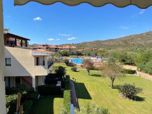 an aerial view of a house with a yard at Sardegna Beach Eucalyptus in Golfo Aranci