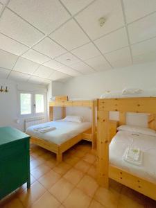 Poschodová posteľ alebo postele v izbe v ubytovaní Arena Surf Hotel