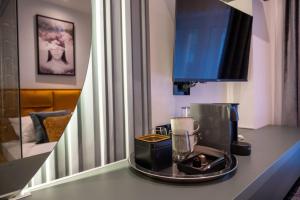 a kitchen counter with a blender on a table at Natali luxury suites- mini rooms in Belgrade