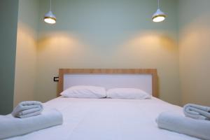 Postel nebo postele na pokoji v ubytování Hotel Jali