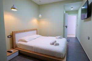 Postel nebo postele na pokoji v ubytování Hotel Jali