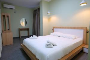 Postel nebo postele na pokoji v ubytování Hotel Jali