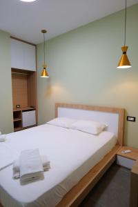 Postel nebo postele na pokoji v ubytování Hotel Jali