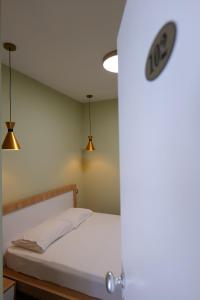 Postel nebo postele na pokoji v ubytování Hotel Jali