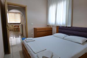 Postel nebo postele na pokoji v ubytování Hotel Jali