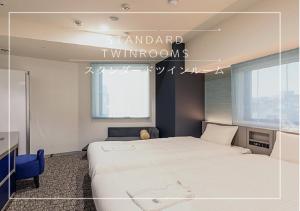 Postel nebo postele na pokoji v ubytování Henn na Hotel Tokyo Hamamatsucho
