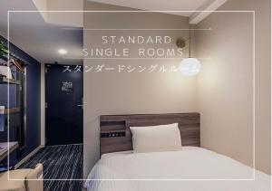 Postel nebo postele na pokoji v ubytování Henn na Hotel Tokyo Hamamatsucho