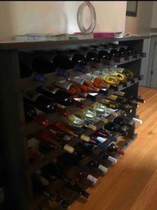 a wine rack filled with lots of wine bottles at The Fallen Tree Inn in Geneva