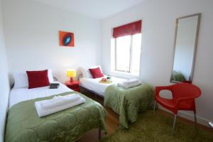 En eller flere senge i et værelse på Parrotfish Bay