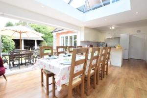 a kitchen and dining room with a table and chairs at Rippleway, Walberswick in Walberswick