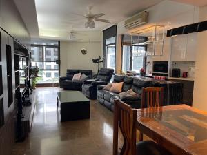 a living room with a couch and a table at River Place in Singapore