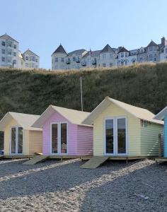 a row of houses sitting on the beach at Seaview on the beach in Port Erin