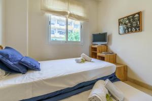 Postel nebo postele na pokoji v ubytování CT 187 - Calanova Golf Suite