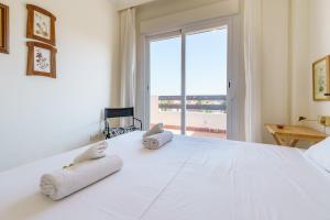 Postel nebo postele na pokoji v ubytování CT 187 - Calanova Golf Suite